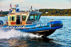 lifestyle photography of police boat on the water for Raymarine FLIR in Hudson, NH