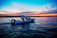 lifestyle photography of police boat on the water at sunset for Raymarine FLIR in Hudson, NH