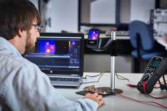 Lifestyle photography of man using FLIR ETS320 for FLIR