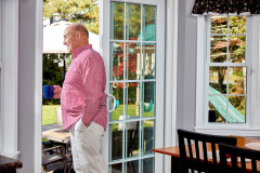 lifestyle photography of man looking outside for Renoviso in Boston, MA