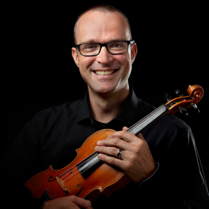 man holding violin headshot photography with black background man holding violin headshot photography with black background