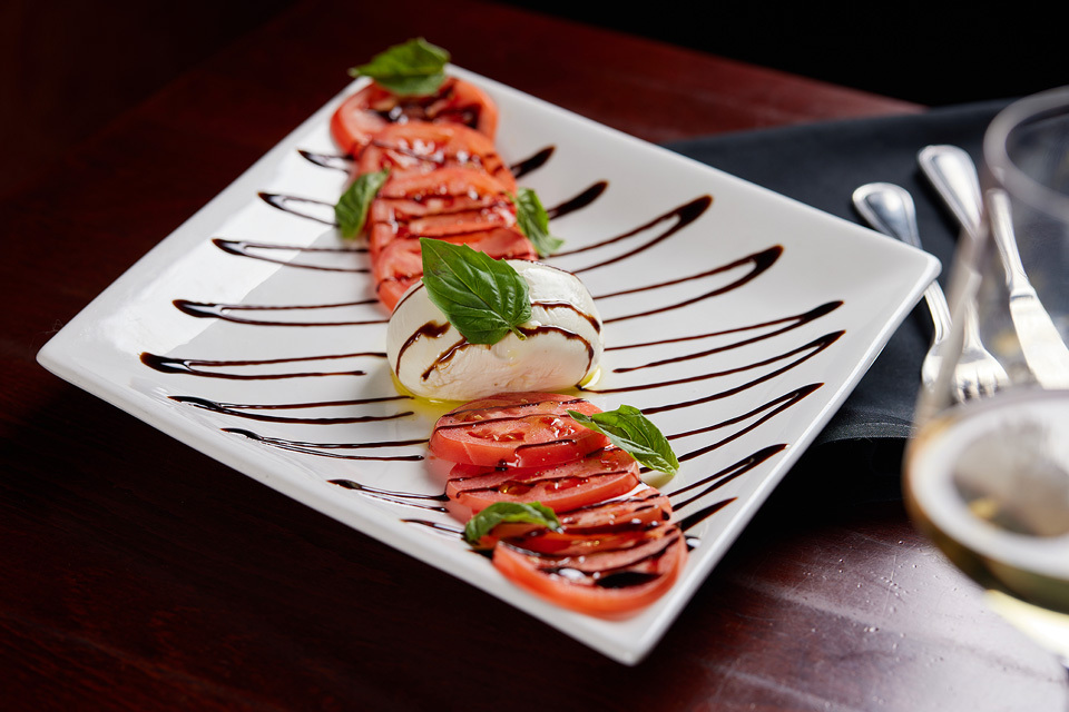 food photography of a tomato and burrata dish photographed for Stir Martini Bar of Westford, MA food photography of a tomato and burrata dish photographed for Stir Martini Bar of Westford, MA