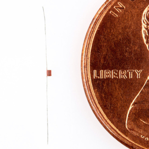 Commercial product photography of Microwave Components Inc's coil size comparison to a penny for MCI in Dracut, MA Commercial product photography of Microwave Components Inc's coil size comparison to a penny for MCI in Dracut, MA