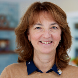 woman headshot photography with office background for headshot shoot with Northwoods Builders in Acton, MA woman headshot photography with office background for headshot shoot with Northwoods Builders in Acton, MA