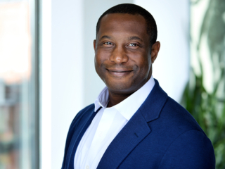 man headshot with office background for headshot photography with Rare Beauty Brands at a WorkBar in Boston, MA
