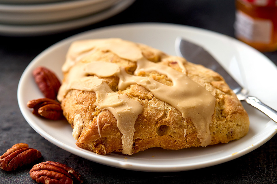 Maple scone on a plate with almonds for Annies Gluten Free Bakery of Shirley, MA