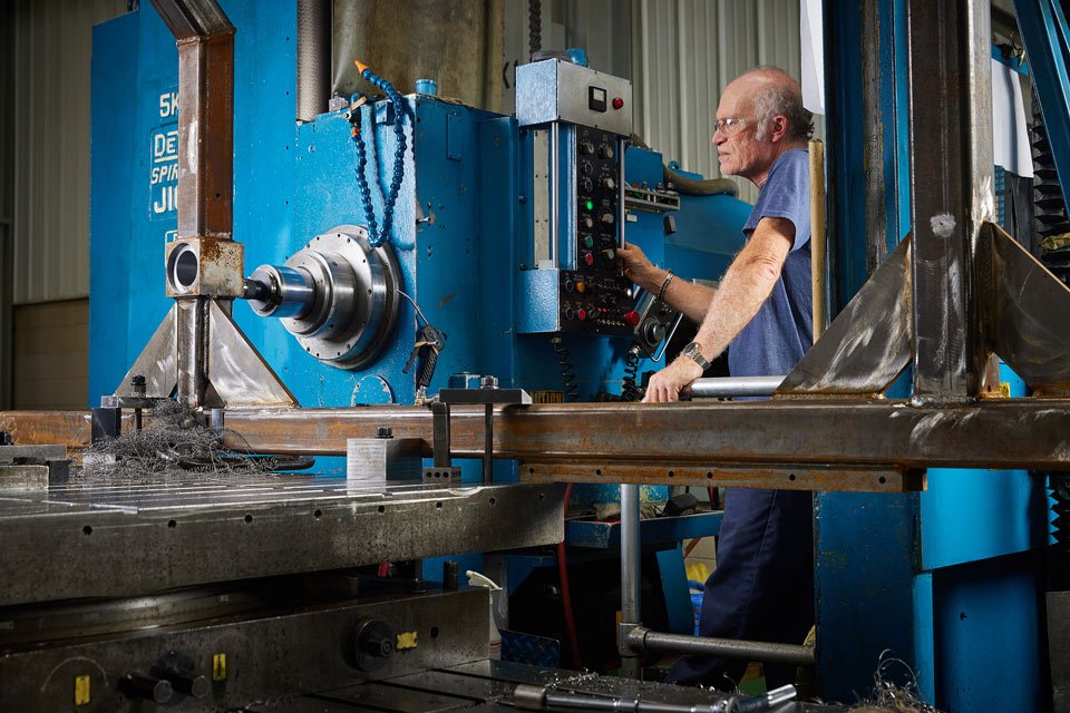 lifestyle photography of male employee operating a machine for B and F Machines of New Britain, CT.