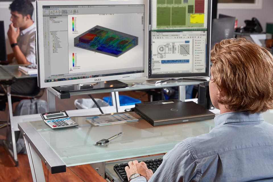 Lifestyle photography of man working on his computer for Datum of Watertown, MA.