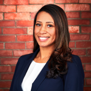 woman headshot photography with brick background for Voccola Law in Providence, RI