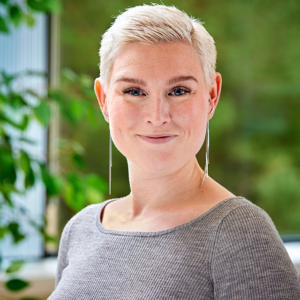 woman headshot photography with office background for Getinge in Merrimack, NH woman headshot photography with office background for Getinge in Merrimack, NH