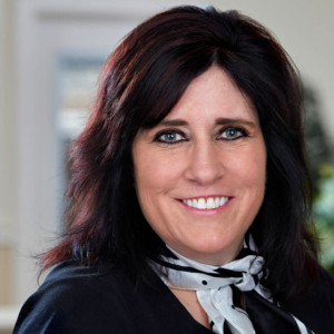 woman headshot photography with office background for Perkins and Anctil in Westford, MA woman headshot photography with office background for Perkins and Anctil in Westford, MA