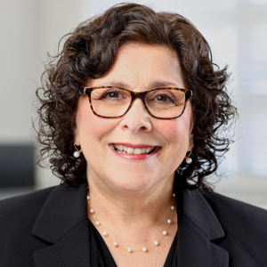 woman headshot photography with office background for Coldwell Banker Realty in Lynnfield, MA woman headshot photography with office background for Coldwell Banker Realty in Lynnfield, MA