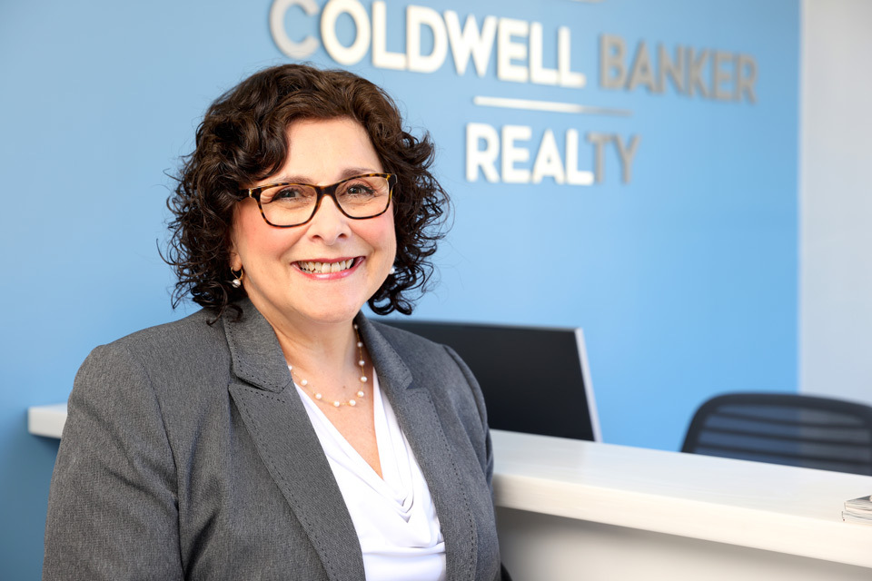 woman headshot photography with office background for Coldwell Banker Realty in  Lynnfield, MA
