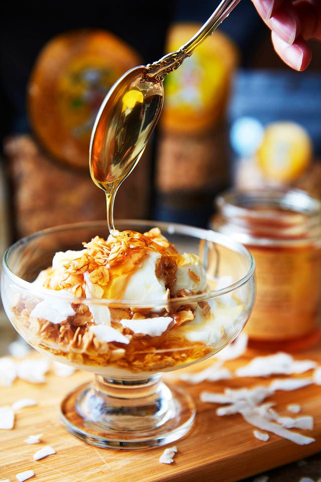food photography of honey drizzled on parfait for Golden Girl Granola of  Shirley, MA