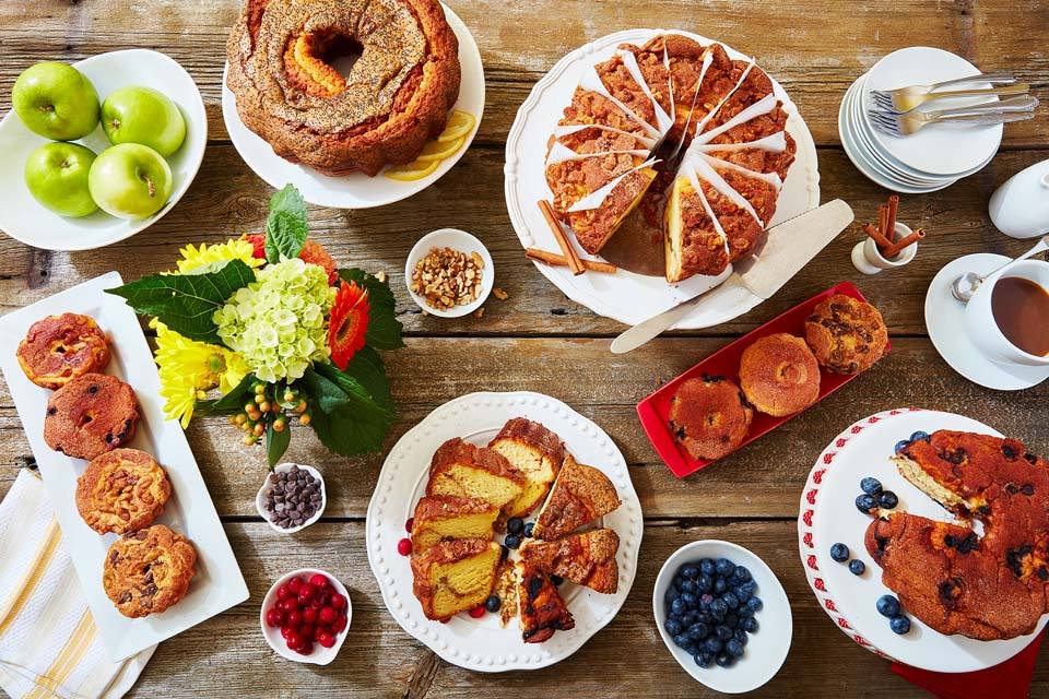 food photography of coffee cakes all over a table for My Grandma's of New England in Boston, MA