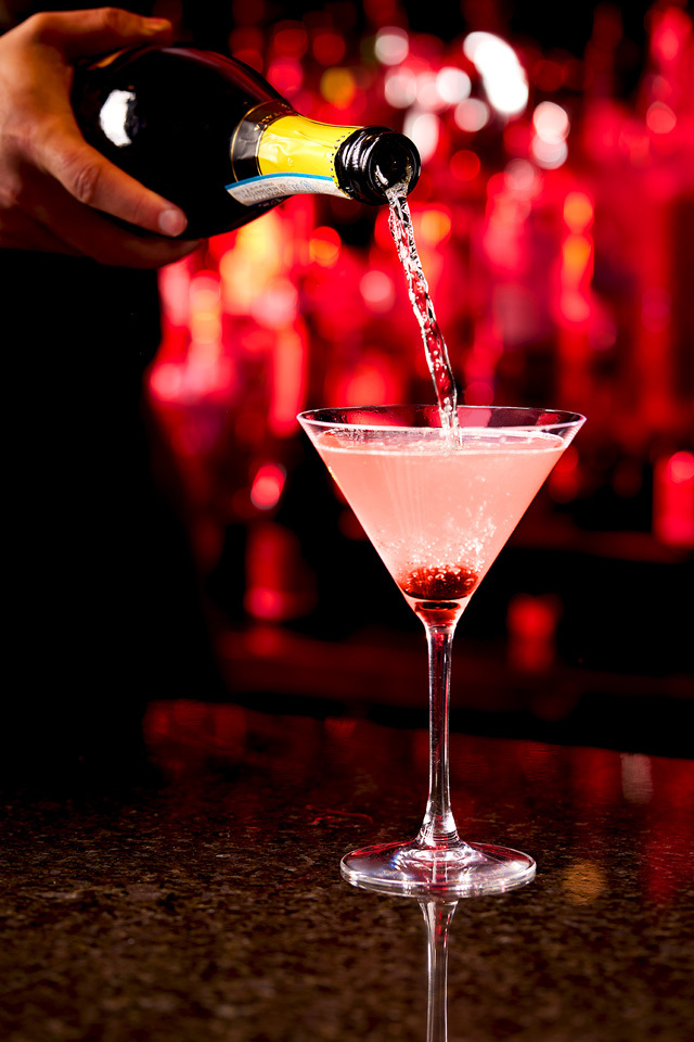 food photography of a pink cocktail being poured photographed for Stir Martini Bar of Westford, MA