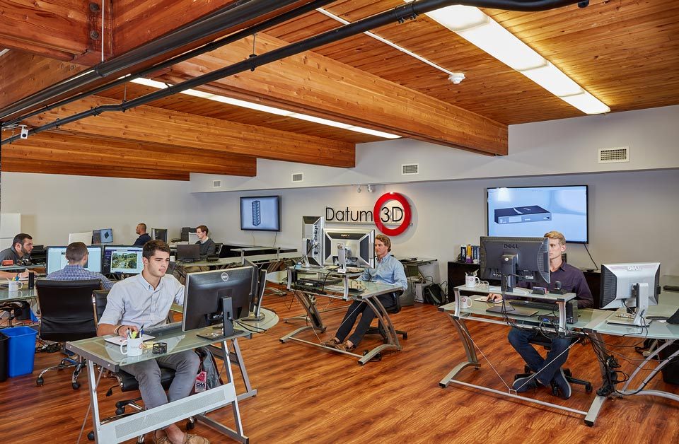 lifestyle photography of an office of men working on computers at their desks for Datum of Watertown, MA.