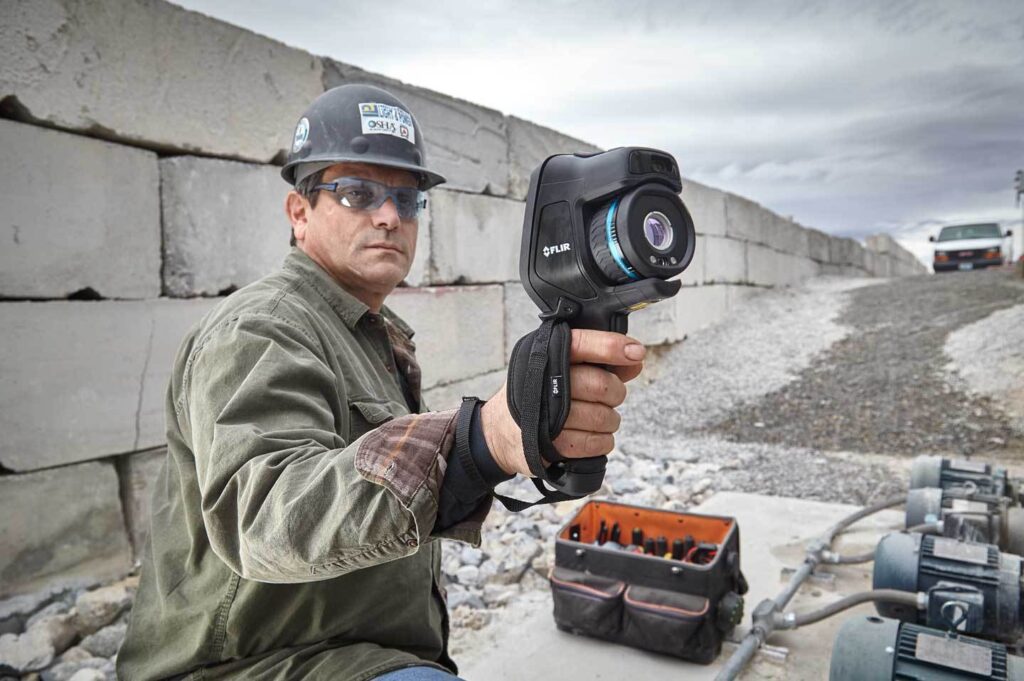 Lifestyle photography man using FLIR E95 thermal camera for Teledyne-FLIR of Hudson, NH