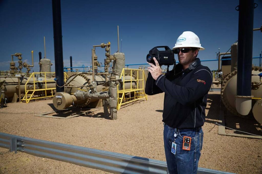 Lifestyle photography of male worker outside using FLIR GFX320 thermal camera for Teledyne-FLIR of Hudson, NH.
