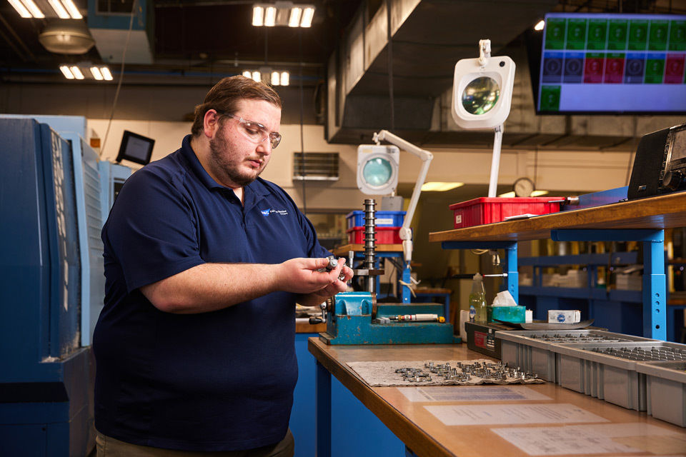 lifestyle photography of Fairview employee working quality control for Fairview of Topsfield, MA.