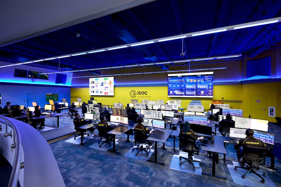 Lifestyle photography of Prosegur office while security agents work at their desk computers for Prosegur of Lowell, MA.