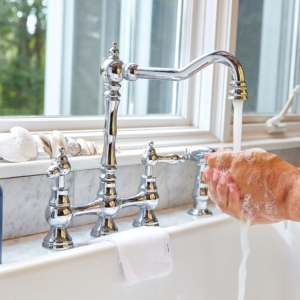 Lifestyle photography of person washing their hands with hand soap for Three Main of Boston, MA.