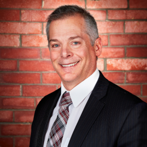 male headshot photography with brick background for Voccola Law in Providence, RI