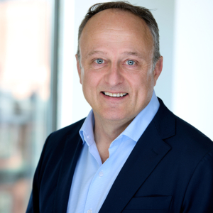 man headshot with office background for headshot photography with Rare Beauty Brands at a WorkBar in Boston, MA man headshot with office background for headshot photography with Rare Beauty Brands at a WorkBar in Boston, MA