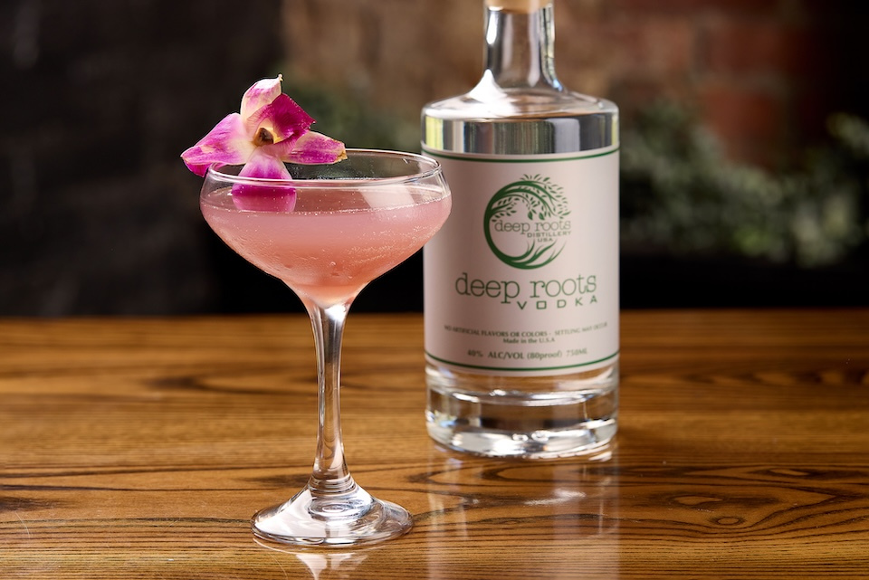 Martini alongside bottle of Deep Roots vodka for Deep Roots Distillery of Sturbridge, MA