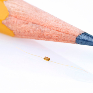 Commercial product photography of Microwave Components Inc's coil size comparison to the tip of a pencil for MCI in Dracut, MA