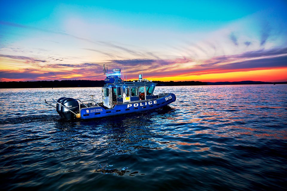 lifestyle photography of police boat on the water at sunset for Raymarine Teledyne-FLIR of Hudson, NH.