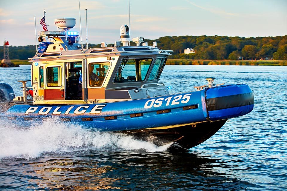 lifestyle photography of police boat on the water for Raymarine Teledyne-FLIR in Hudson, NH
