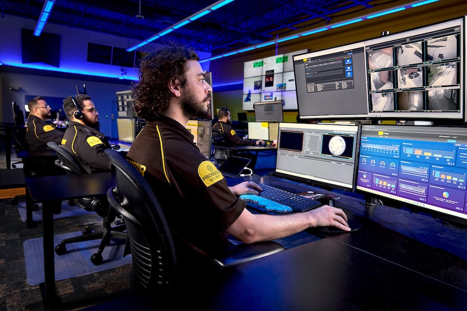 Lifestyle photo of Prosegur male security agents remotely monitoring for Prosegur of Lowell, MA.